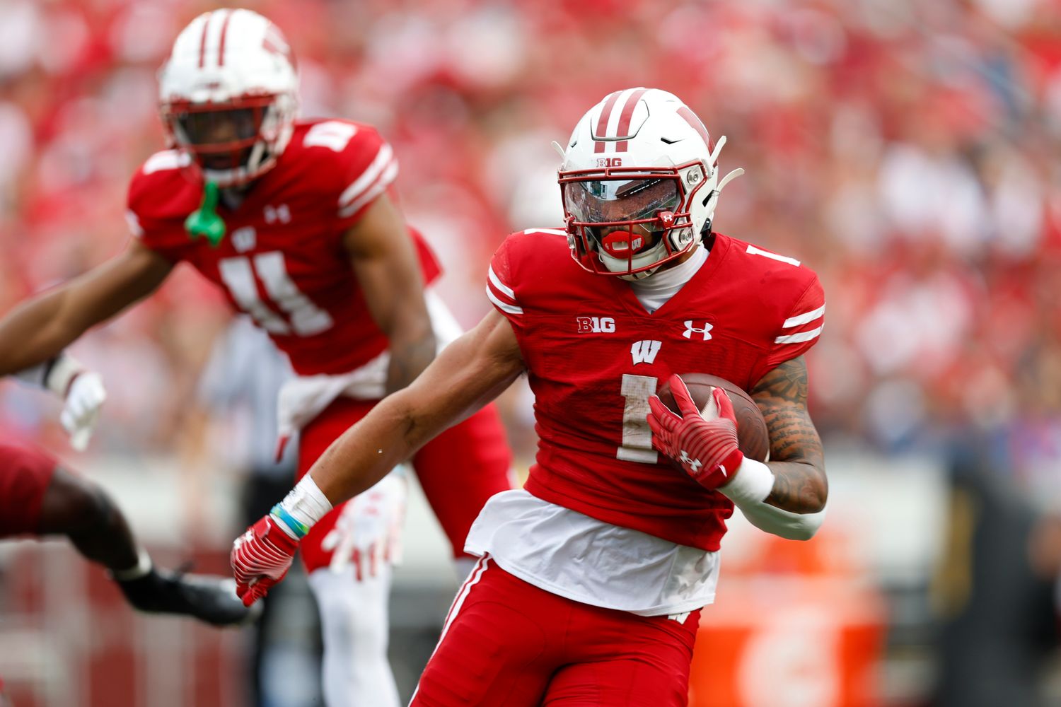 Wisconsin running back Chez Mellusi running with the ball against New Mexico State.